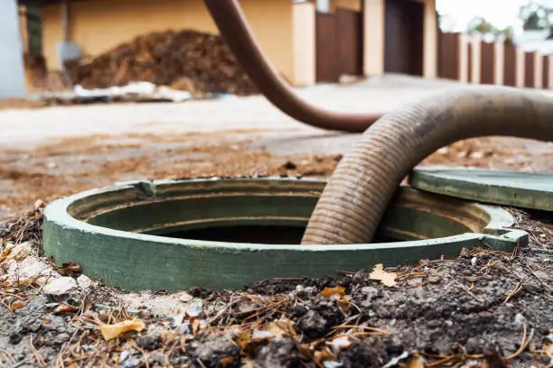 Drain Cleaning in Pensacola - FL underway as a technician clears a kitchen sink line